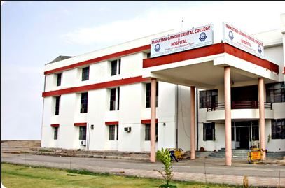 Mahatma Gandhi Dental College & Hospital Logo